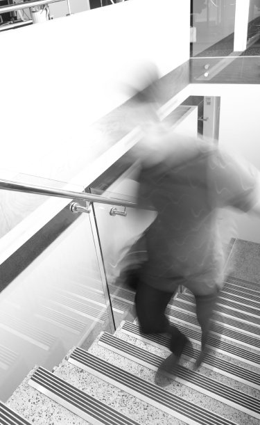 blurred picture person walking up stairs
